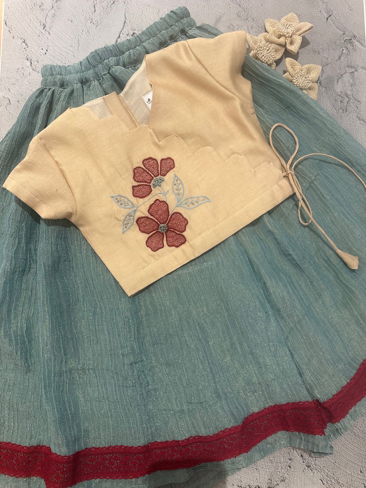 beige and blue appliqué skirt set