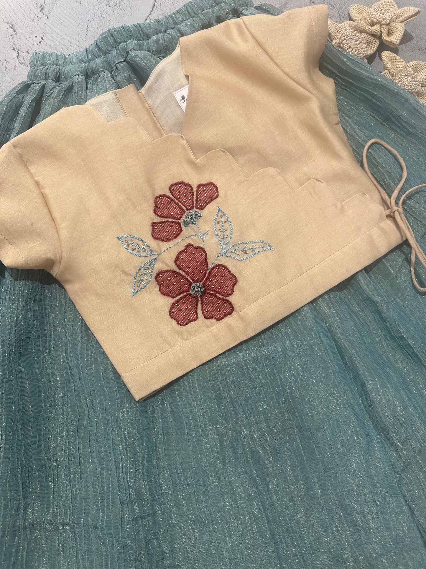 beige and blue appliqué skirt set